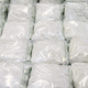 Packs of methamphetamine crystals are displayed behind a cordon during a press conference at the Customs Headquarters Building (CHB) in Hong Kong on December 17, 2019, after authorities at the city's international airport on December 5 seized some 110 kilograms of the substance with an estimated market value of nearly 10 million USD, the largest methamphetamine trafficking case since 2010.